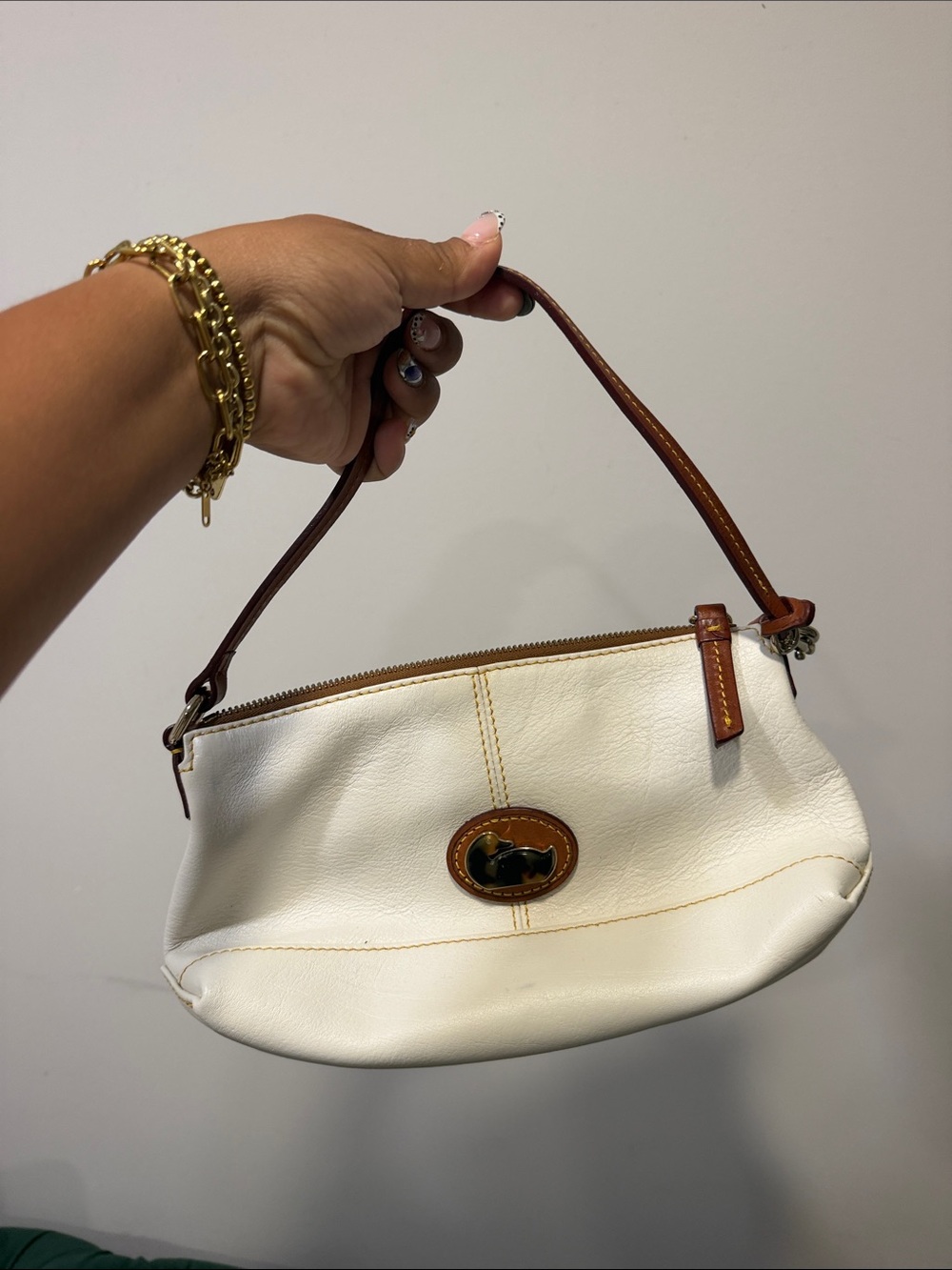 Dooney & Bourke Cream Leather Wristlet with Brown Trim - Sleek Everyday Clutch